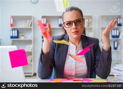 Businesswoman with conflicting priorities in office. The businesswoman with conflicting priorities in office