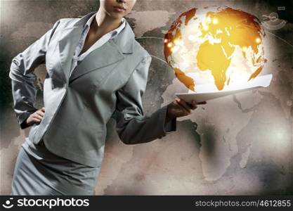 Businesswoman with documents. Close up of businesswoman against digital background