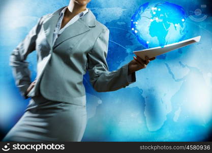 Businesswoman with documents. Close up of businesswoman against digital blue background