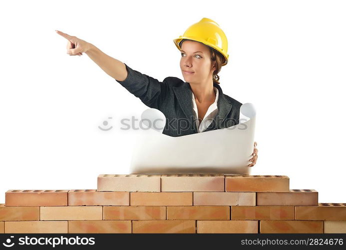 Businesswoman with drawings near brick wall