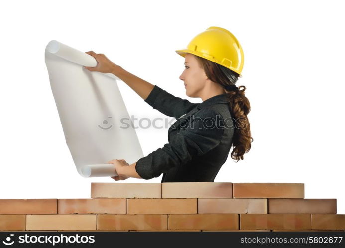 Businesswoman with drawings near brick wall