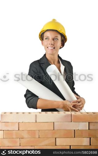 Businesswoman with drawings near brick wall