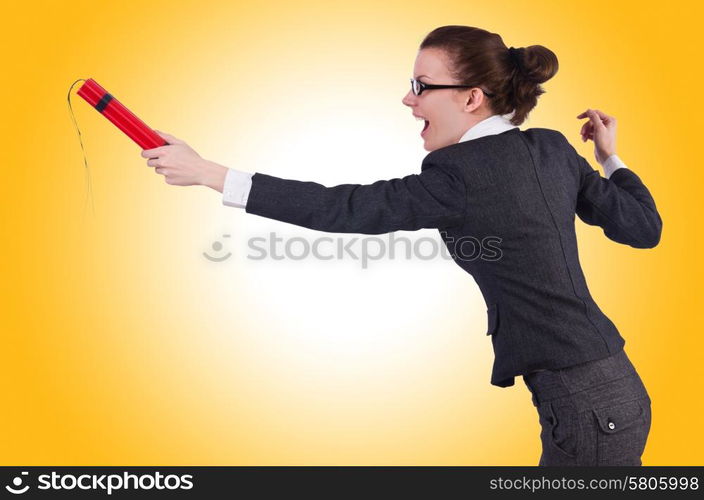 Businesswoman with dynamite on white