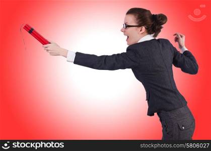 Businesswoman with dynamite on white