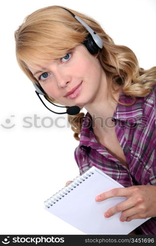 businesswoman with earphones and notepad