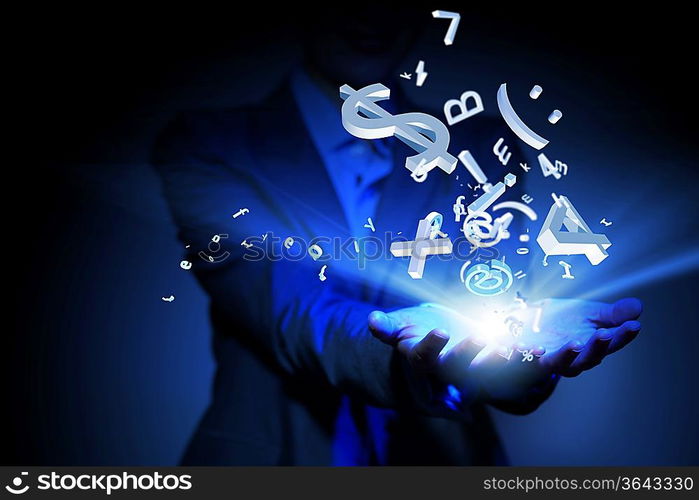 Businesswoman with financial symbols coming from her hand