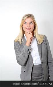 Businesswoman with hand on chin