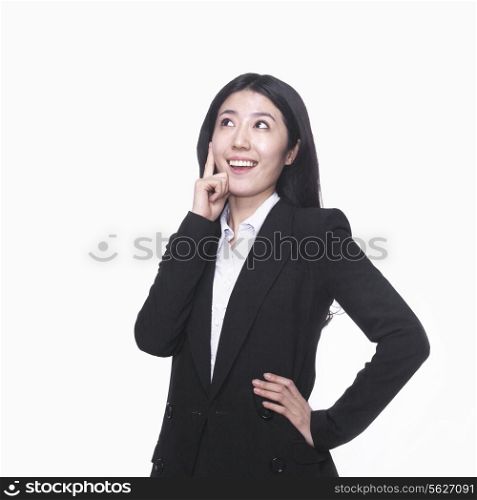 Businesswoman with hand on chin thinking
