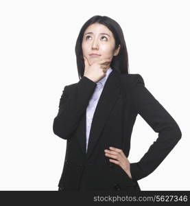 Businesswoman with hand on chin thinking