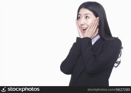 Businesswoman with hands on face acting surprised