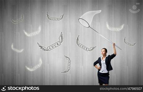 Businesswoman with hoop. Young businesswoman catching word profit with hoop