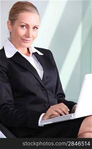 Businesswoman with laptop.