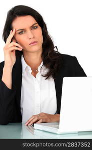 Businesswoman with laptop at a desk