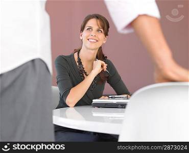 Businesswoman with laptop at table