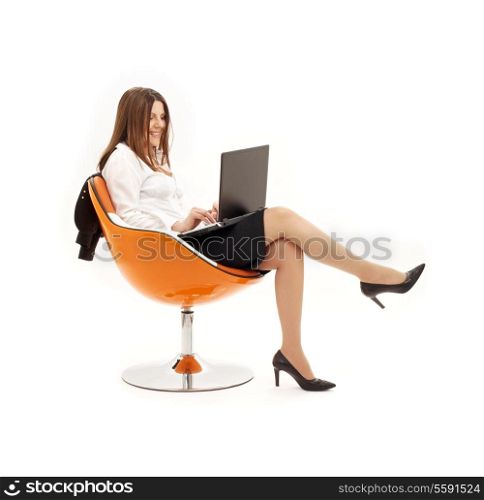 businesswoman with laptop in orange chair over white