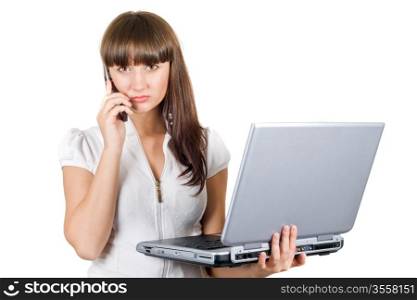 Businesswoman with laptop speaks on the phone