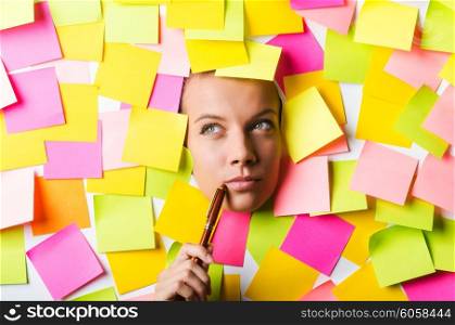 Businesswoman with lots of reminder notes