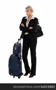 Businesswoman with luggage waiting