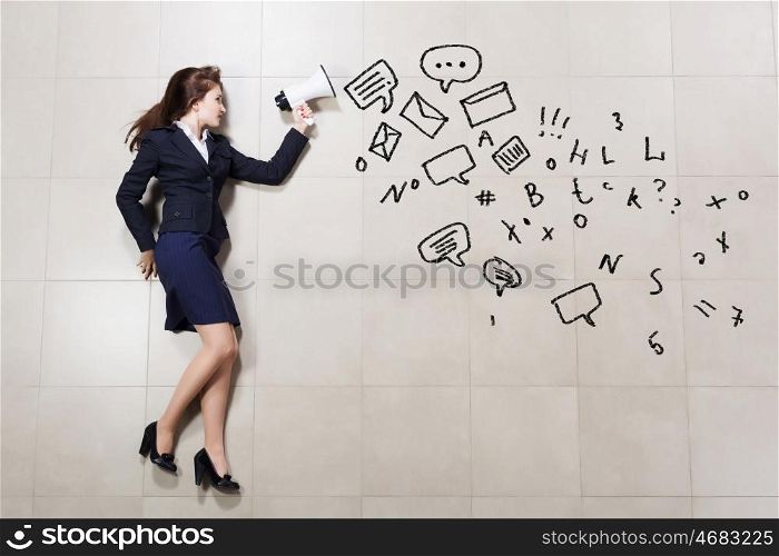 Businesswoman with megaphone. Funny image of businesswoman running with megaphone in hands