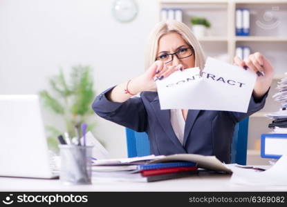 Businesswoman with message in office at desk