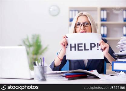 Businesswoman with message in office at desk