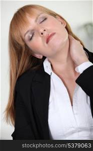 Businesswoman with neck ache