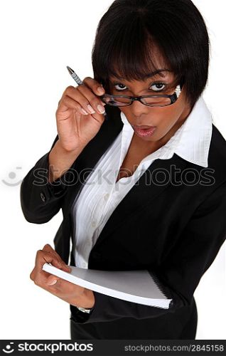 Businesswoman with notepad and pen