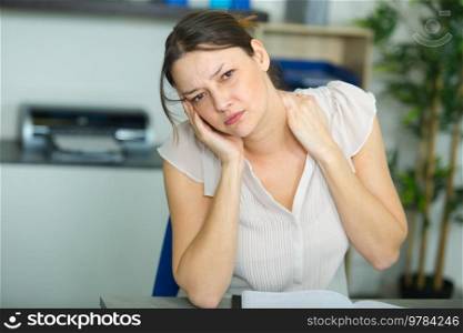 businesswoman with pain in neck