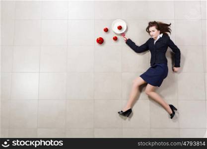 Businesswoman with pan. Funny woman in business suit with pan in hand