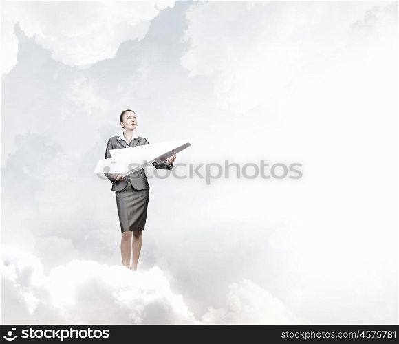 Businesswoman with paper plane. Attractive businesswoman holding paper plane in hands