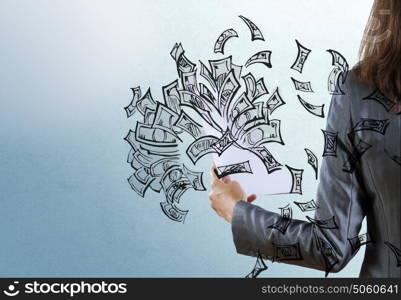 Businesswoman with papers in hand. Rear view of businesswoman and money banknotes flying in air