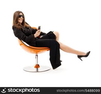 businesswoman with phone in orange chair over white