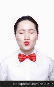 Businesswoman with red tie, kissing face