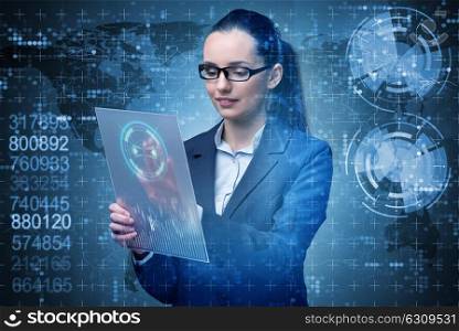 Businesswoman with tablet in business concept