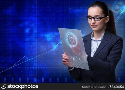 Businesswoman with tablet in business concept
