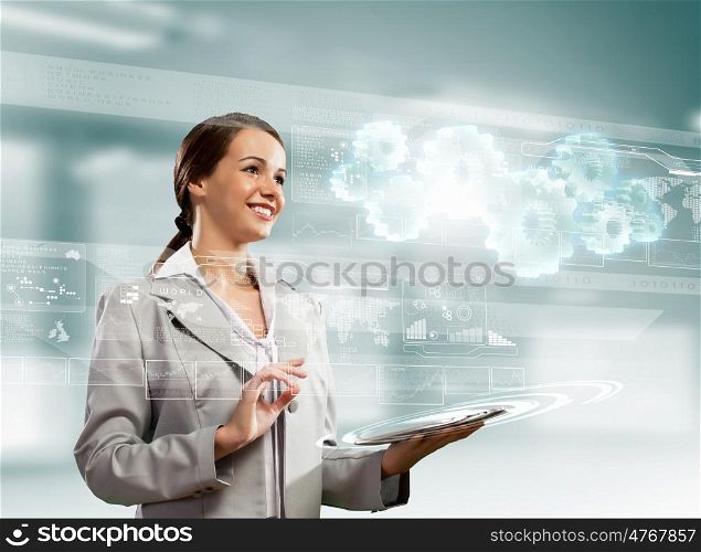 Businesswoman with tablet pc. Image of businesswoman with tablet pc against high-tech background