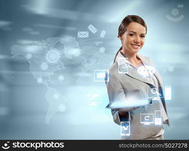 Businesswoman with tablet pc. Image of businesswoman with tablet pc against high-tech background