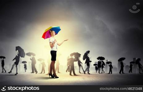 Businesswoman with umbrella. Image of pretty businesswoman with umbrella walking in crowd of people