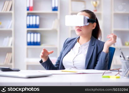 Businesswoman with virtual reality glasses in office