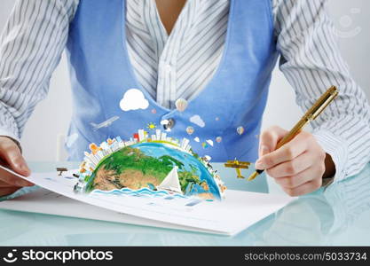 Businesswoman working at desk. Young businesswoman writing document in office. Elements of this image are furnished by NASA