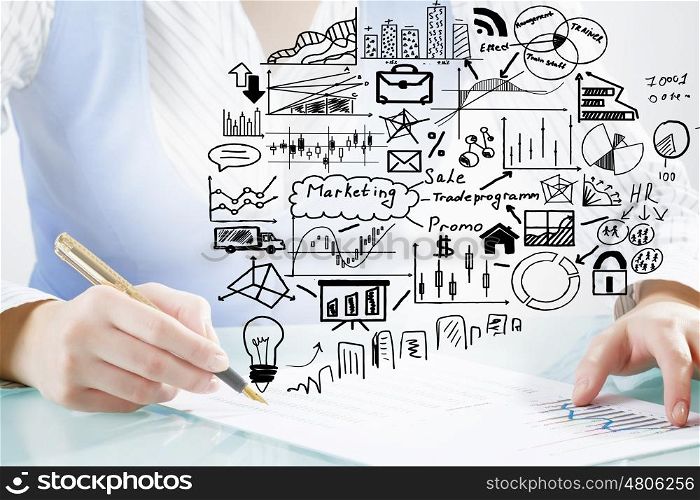 Businesswoman working at her desk. Close up of female hand writing with pen business sucess strategy