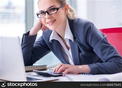 Businesswoman working at her desk in office