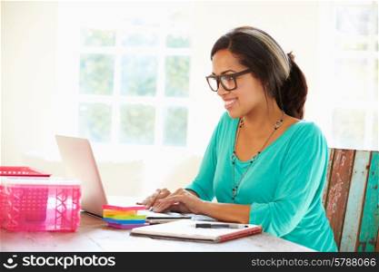 Businesswoman Working In Office At Home
