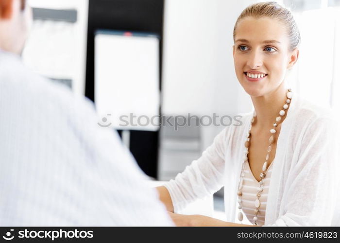 Businesswoman working in office. Happy businesswoman in office with her colleague