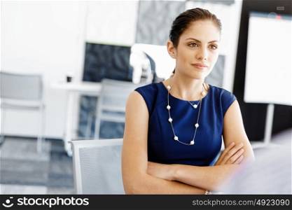 Businesswoman working in office. Happy businesswoman in office with her colleague