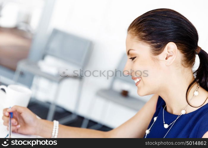 Businesswoman working in office. Happy businesswoman in office with her colleague