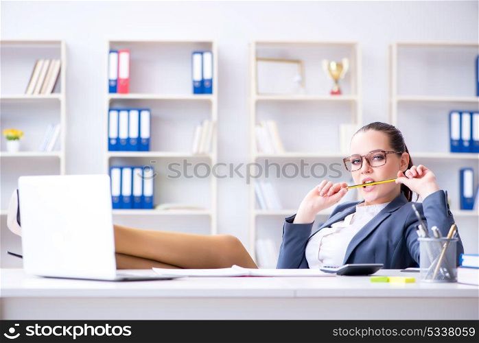 Businesswoman working in the office at desk