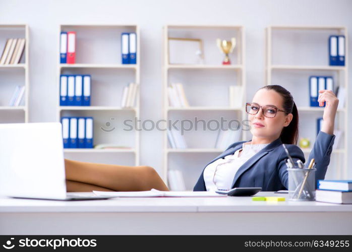 Businesswoman working in the office at desk