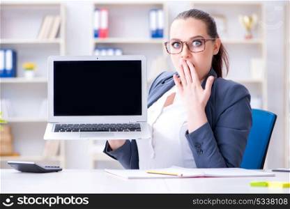 Businesswoman working in the office at desk. The businesswoman working in the office at desk