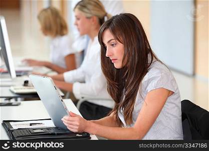 Businesswoman working in the office on electronic pad